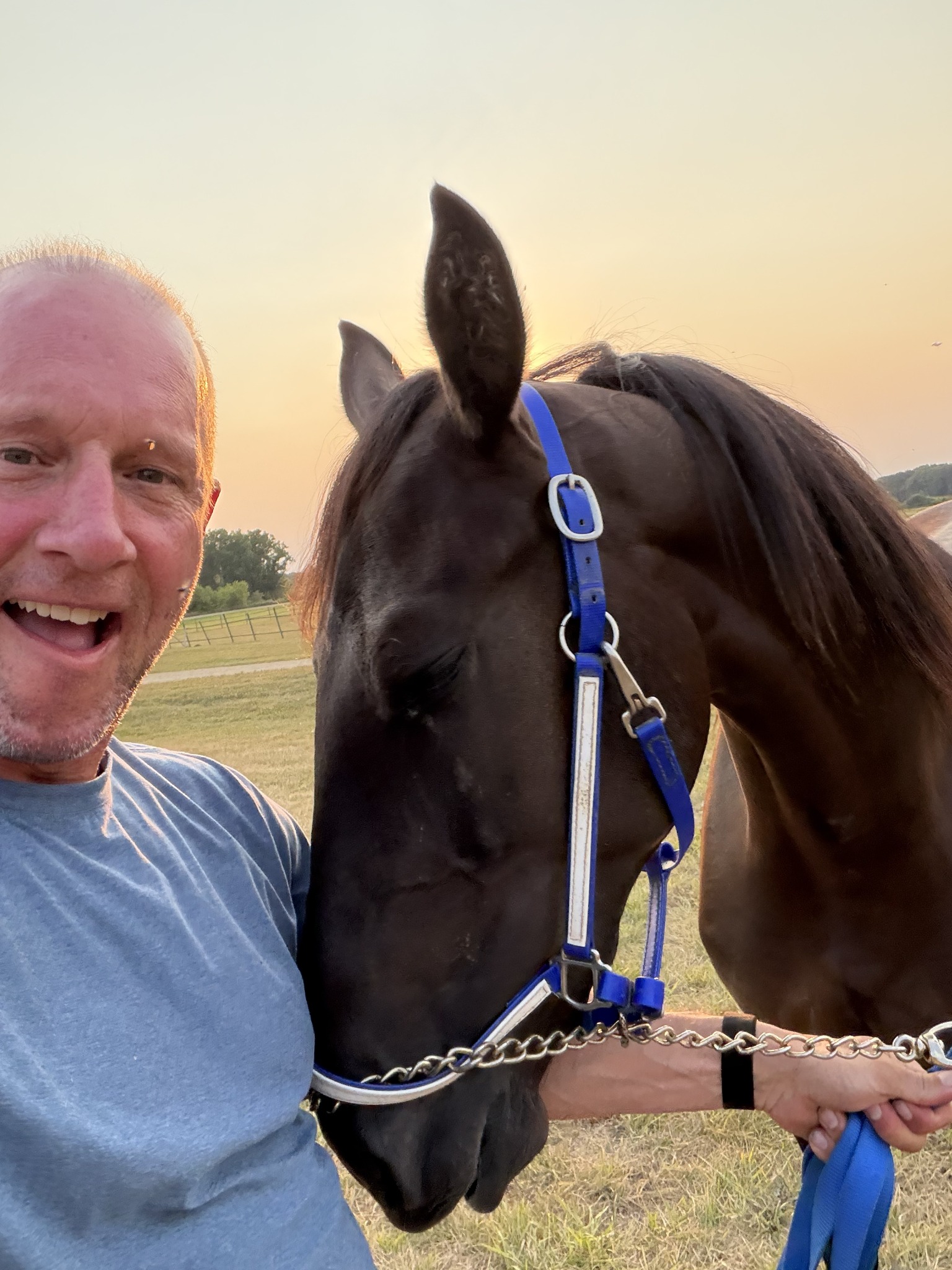 Owner enjoying time with a horse